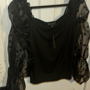 Gorgeous black puff sleeve top with polka dots.